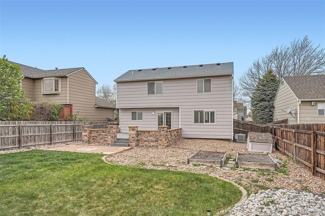 5130 S Wenatchee St, Aurora, CO 80015 - rear view of property featuring a garden