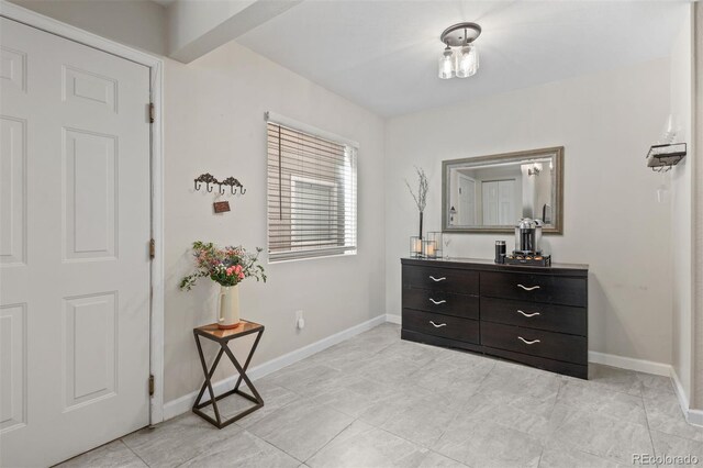 3600 S Pierce St Unit 7-208, Denver, CO 80235 - entrance foyer featuring baseboards