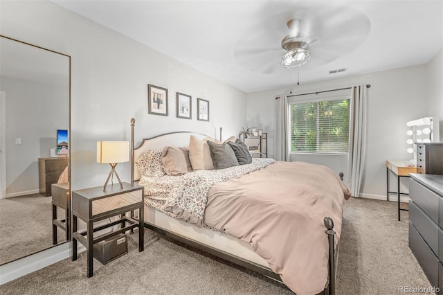 3600 S Pierce St Unit 7-208, Denver, CO 80235 - carpeted bedroom featuring baseboards and ceiling fan