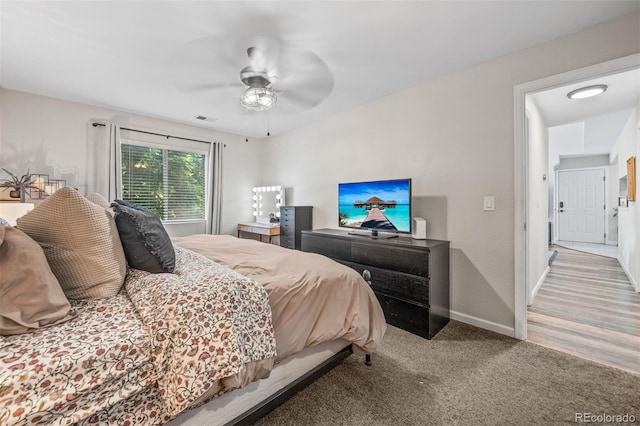 3600 S Pierce St Unit 7-208, Denver, CO 80235 - carpeted bedroom featuring baseboards and a ceiling fan