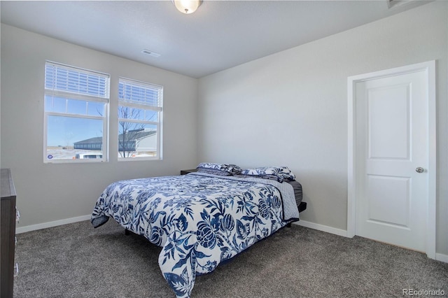 bedroom with dark carpet