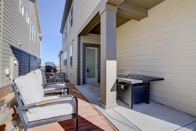 wooden deck with a patio area