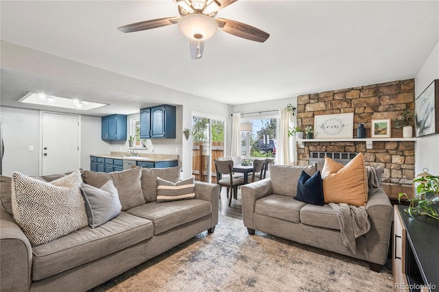 1080 S Yampa St, Aurora, CO 80017 - living area featuring ceiling fan and wood finished floors
