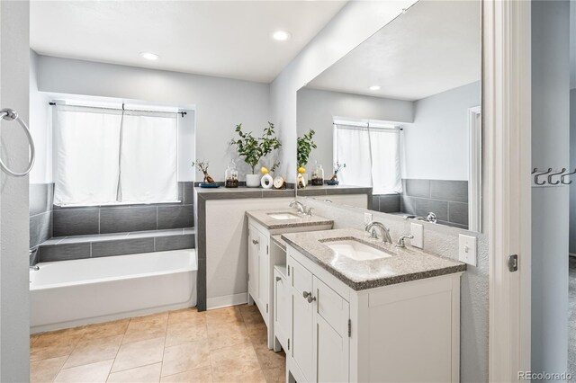 1080 S Yampa St, Aurora, CO 80017 - bathroom with vanity, a bath, tile patterned floors, and recessed lighting