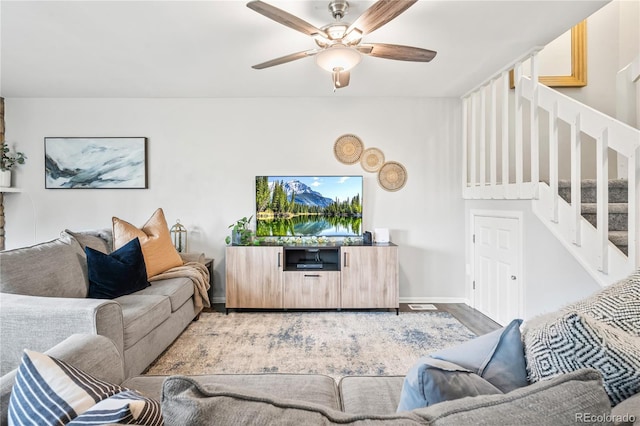 1080 S Yampa St, Aurora, CO 80017 - living room featuring stairs, a ceiling fan, wood finished floors, and baseboards