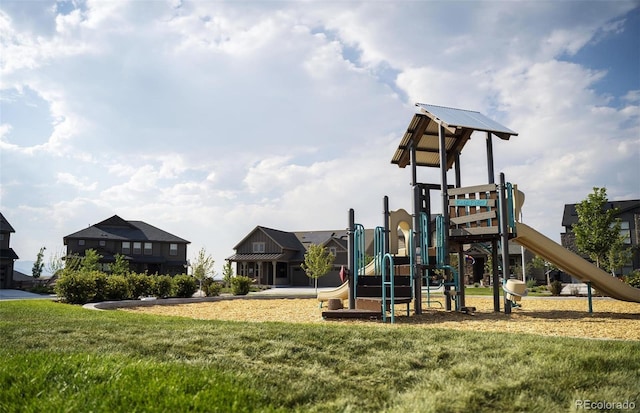 view of jungle gym featuring a lawn