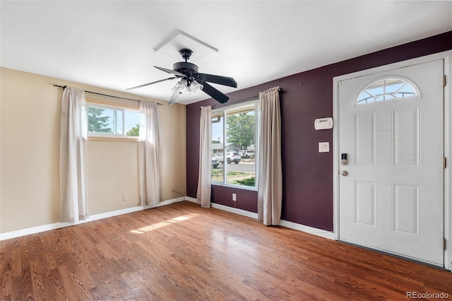 6150 E 65th Ave, Commerce City, CO 80022 - entryway featuring healthy amount of natural light, wood finished floors, and a ceiling fan
