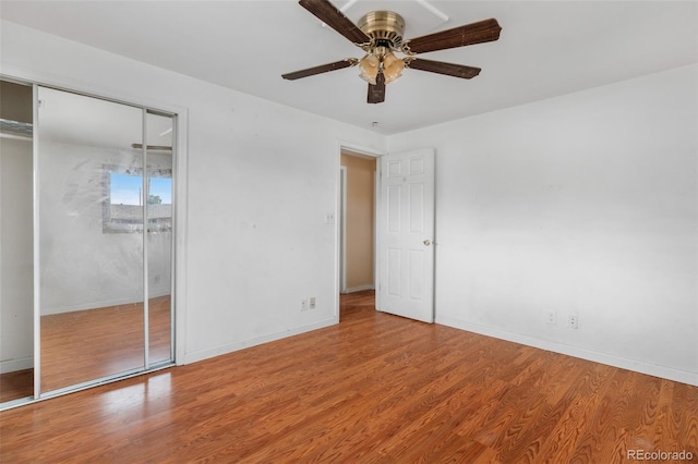 6150 E 65th Ave, Commerce City, CO 80022 - unfurnished bedroom with wood finished floors and ceiling fan