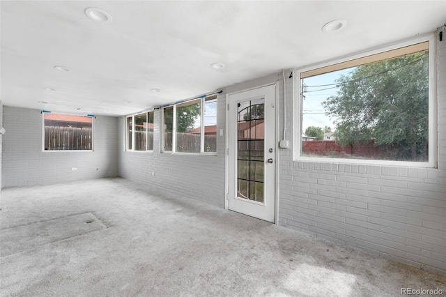 6150 E 65th Ave, Commerce City, CO 80022 - unfurnished sunroom featuring plenty of natural light