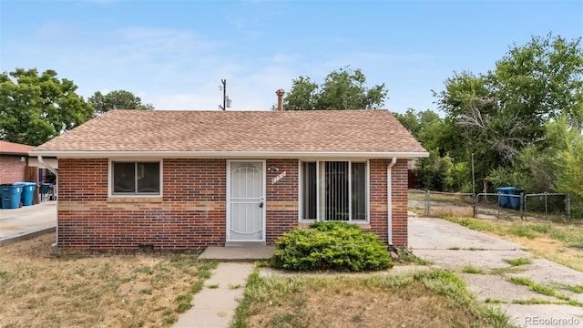 6150 E 65th Ave, Commerce City, CO 80022 - bungalow-style house featuring brick siding and roof with shingles
