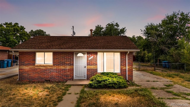 6150 E 65th Ave, Commerce City, CO 80022 - bungalow-style house featuring brick siding and roof with shingles