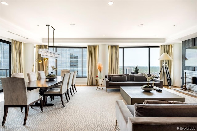 1133 14th St Unit 4150, Denver, CO 80202 - living area featuring a large fireplace, a tray ceiling, and recessed lighting