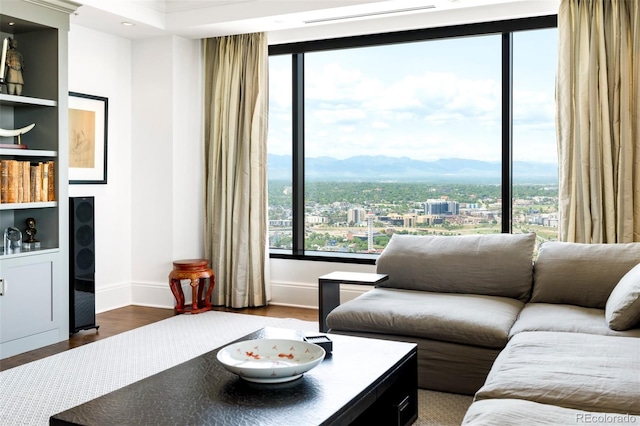 1133 14th St Unit 4150, Denver, CO 80202 - living room featuring a mountain view, wood finished floors, and recessed lighting