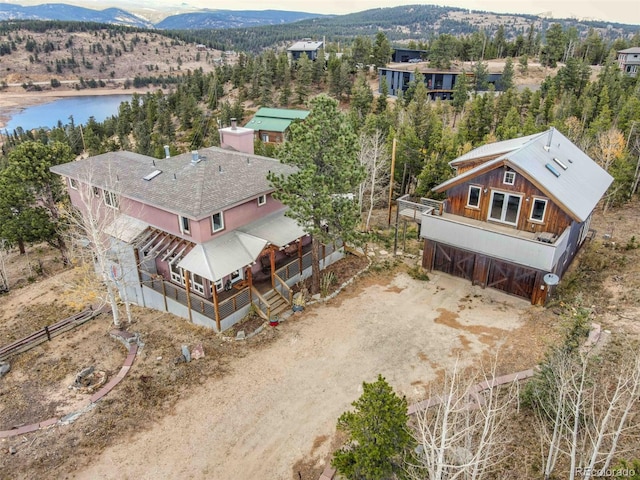 birds eye view of property featuring a water and mountain view