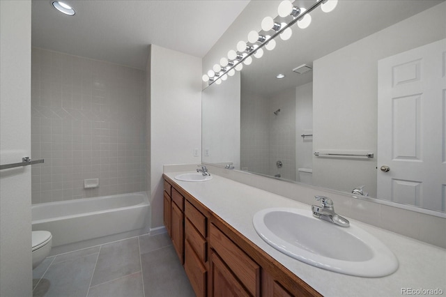 full bath with visible vents, a sink, toilet, and tile patterned floors