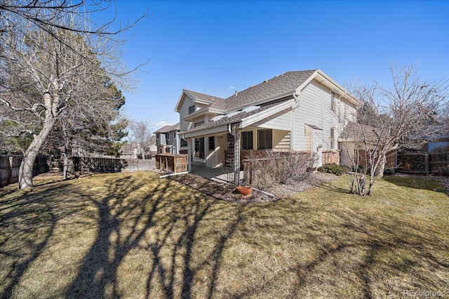 view of property exterior featuring a patio area, a fenced backyard, and a yard