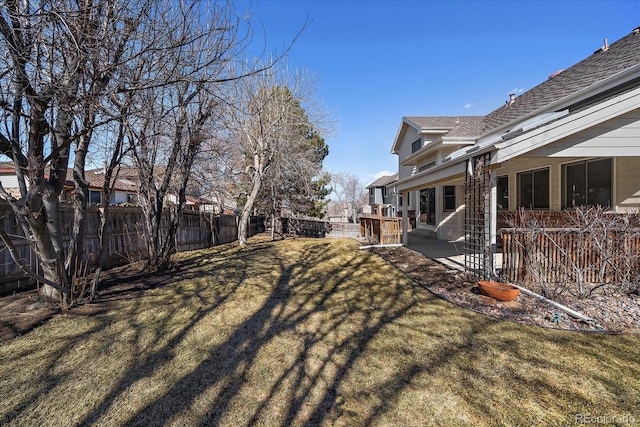 view of yard with a patio area and a fenced backyard