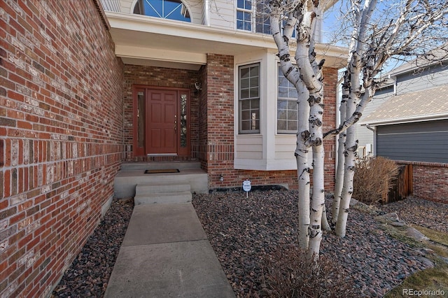 entrance to property with brick siding