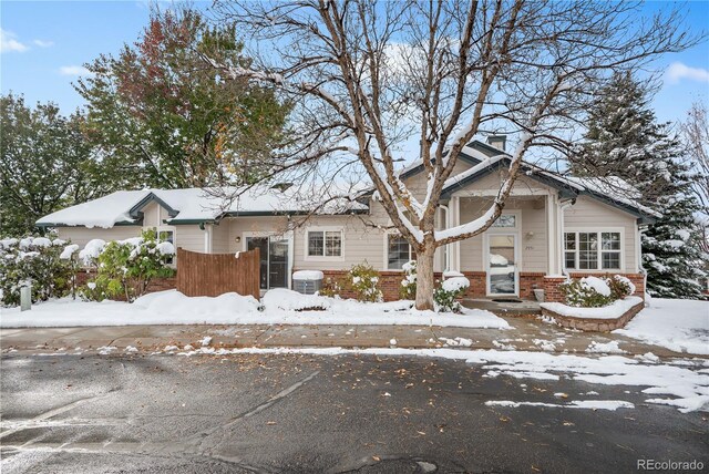 2951 S Walden Ct, Aurora, CO 80013 - view of front of house with brick siding and a chimney