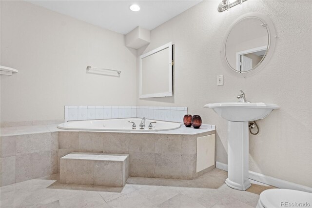 2951 S Walden Ct, Aurora, CO 80013 - bathroom featuring a garden tub, toilet, and tile patterned floors