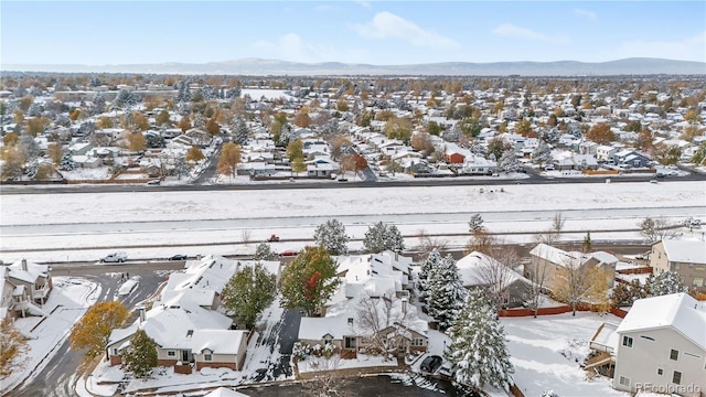 2951 S Walden Ct, Aurora, CO 80013 - snowy aerial view with a residential view and a mountain view
