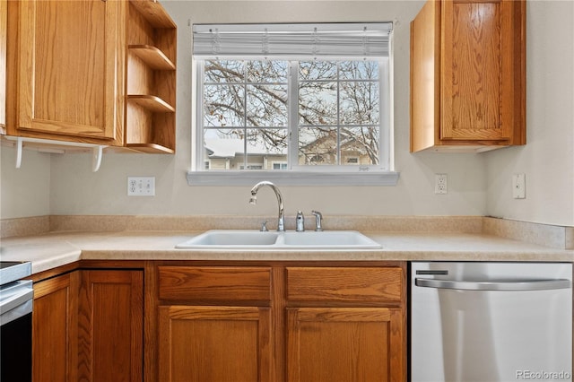 2951 S Walden Ct, Aurora, CO 80013 - kitchen featuring dishwasher, a sink, plenty of natural light, and light countertops