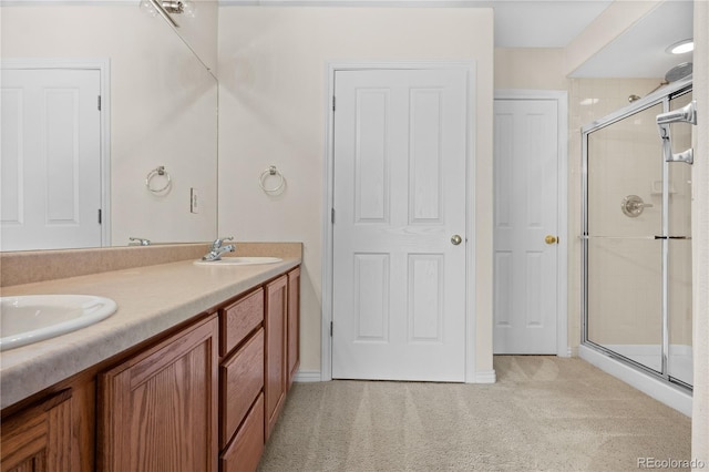 bathroom with vanity and an enclosed shower