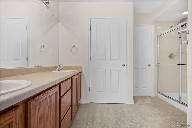 2951 S Walden Ct, Aurora, CO 80013 - bathroom with a stall shower and double vanity