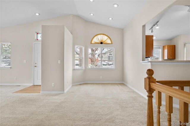 2951 S Walden Ct, Aurora, CO 80013 - unfurnished room with light colored carpet, vaulted ceiling, baseboards, and recessed lighting