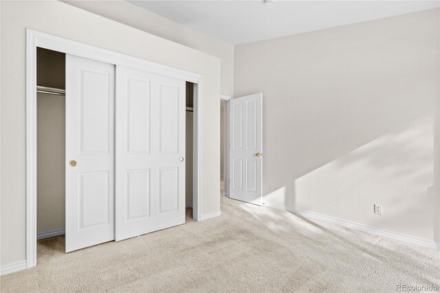 2951 S Walden Ct, Aurora, CO 80013 - unfurnished bedroom with carpet floors, a closet, and baseboards
