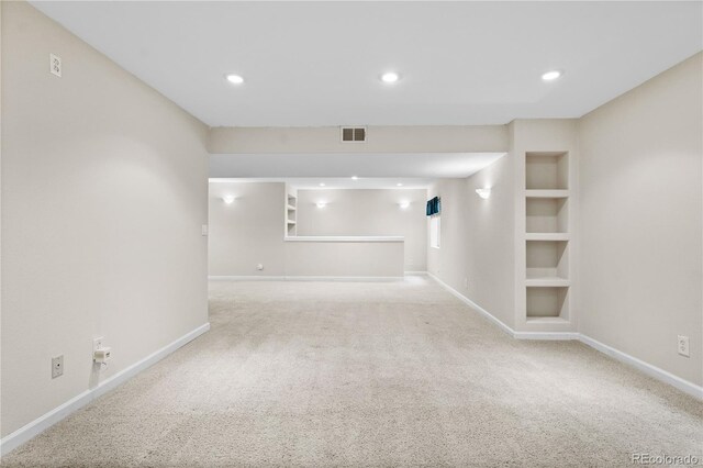 2951 S Walden Ct, Aurora, CO 80013 - below grade area with carpet flooring, baseboards, built in features, and recessed lighting