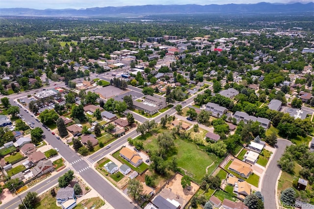 5573 S Huron St, Littleton, CO 80120 - aerial view of property and surrounding area featuring mountains and nearby suburban area