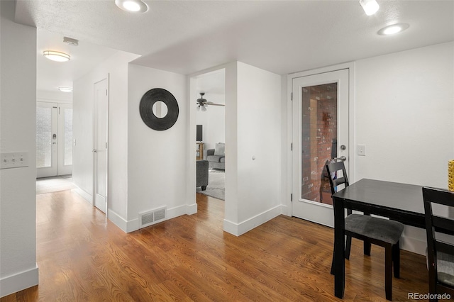 dining area featuring ceiling fan and hardwood / wood-style floors