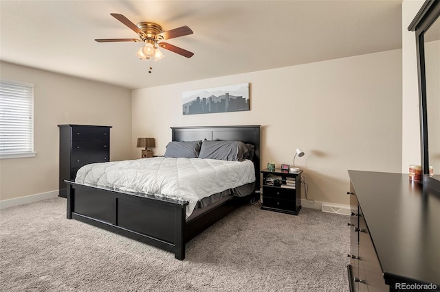 bedroom featuring ceiling fan and light carpet