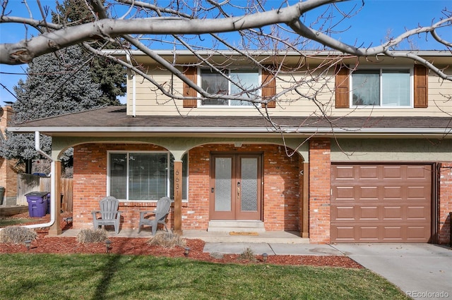 view of front of house with a porch and a garage