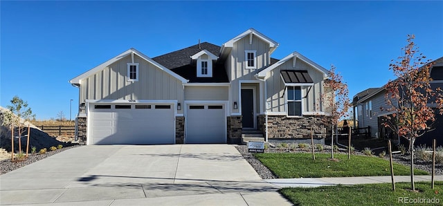 view of front of home with a front lawn and a garage