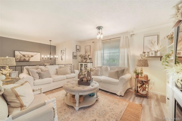 8280 Everett Way, Arvada, CO 80005 - living room featuring a chandelier, wood finished floors, and ornamental molding