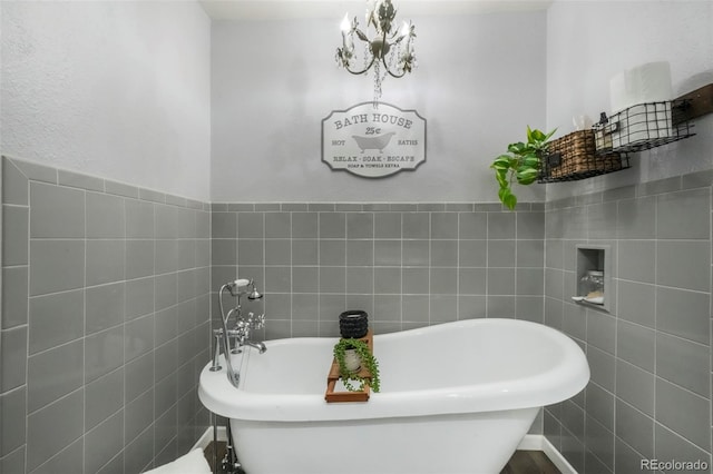 8280 Everett Way, Arvada, CO 80005 - bathroom featuring a soaking tub and tile walls