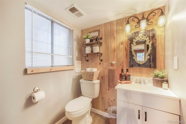 8280 Everett Way, Arvada, CO 80005 - half bathroom featuring vanity and wood finished floors
