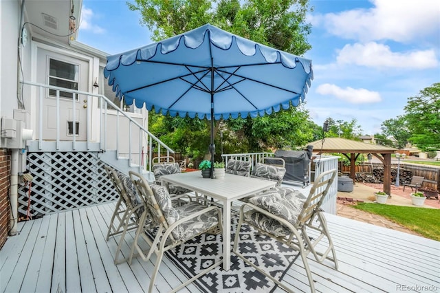 8280 Everett Way, Arvada, CO 80005 - deck with outdoor dining space, a gazebo, and stairs