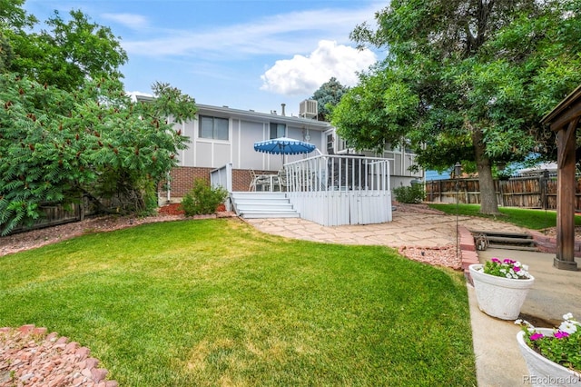 8280 Everett Way, Arvada, CO 80005 - view of yard featuring a patio area and a deck