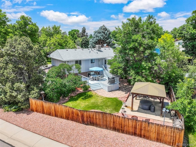 8280 Everett Way, Arvada, CO 80005 - back of property with a gazebo, a deck, and view of scattered trees