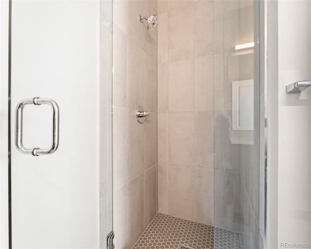 bathroom featuring an enclosed shower