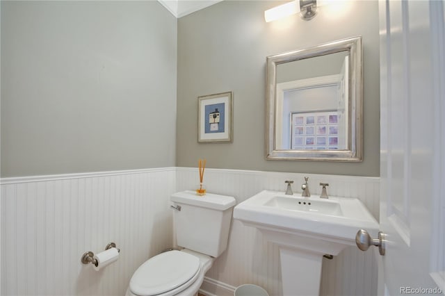 8721 E 23rd Ave, Denver, CO 80238 - bathroom featuring toilet and wainscoting