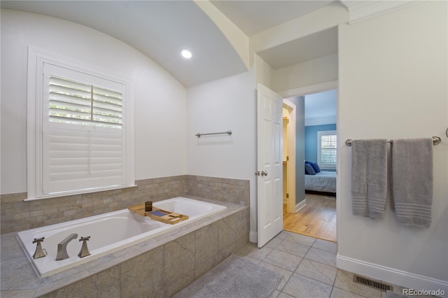 8721 E 23rd Ave, Denver, CO 80238 - ensuite bathroom featuring a bath, tile patterned flooring, baseboards, and recessed lighting