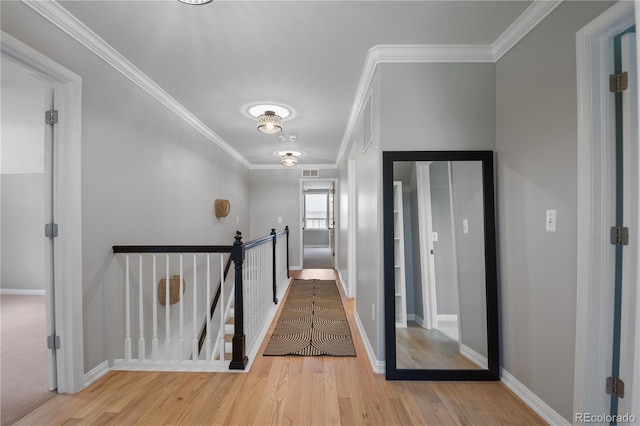 8721 E 23rd Ave, Denver, CO 80238 - hallway with an upstairs landing, ornamental molding, and wood finished floors