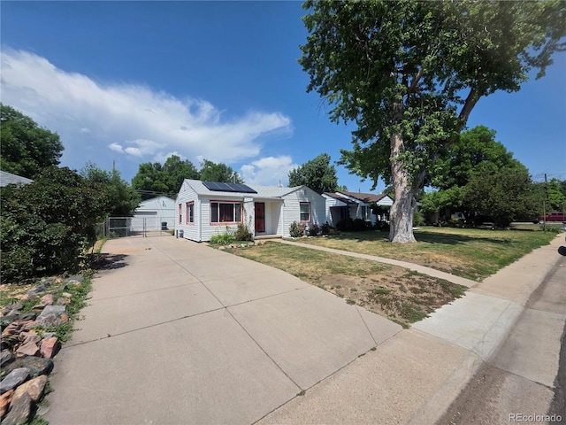 475 Tennyson St, Denver, CO 80204 - view of front of house featuring roof mounted solar panels and a gate