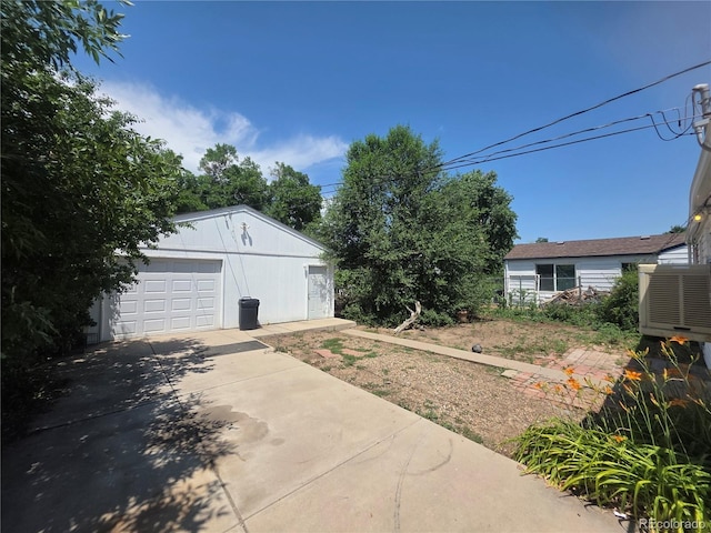 475 Tennyson St, Denver, CO 80204 - view of yard with driveway and a garage