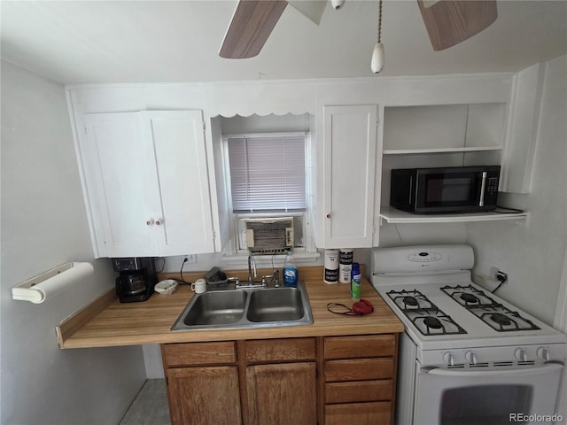 475 Tennyson St, Denver, CO 80204 - kitchen featuring white gas stove, light countertops, white cabinetry, and a ceiling fan