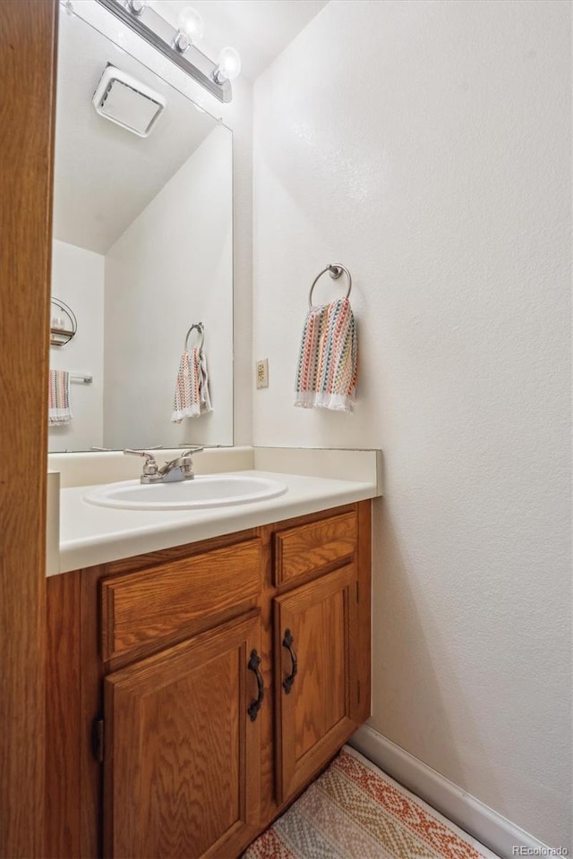 11923 E Ford Dr, Aurora, CO 80012 - bathroom with vanity and baseboards